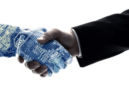 human hand shaking hand with robot hand to symbolize AI should not replace humans